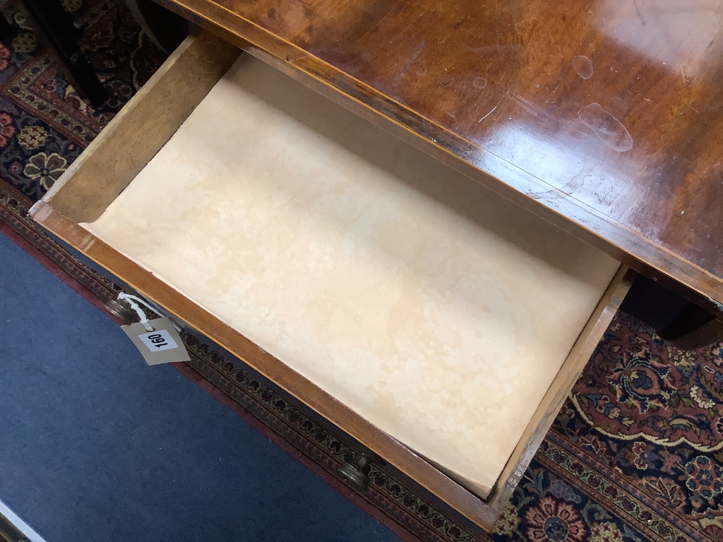 A late Georgian inlaid mahogany pedestal Pembroke table,on quadripartite splayed supports with brass castors, width 92cm depth 52cm height 70cm